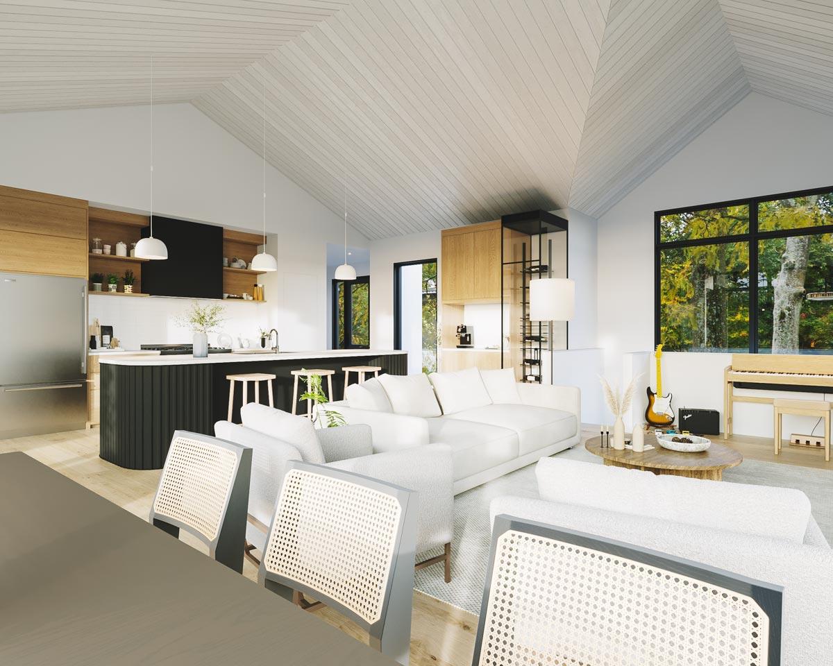 Modern, open-concept living space with a white sofa, kitchen island, and guitar near a large window overlooking a tree-lined area.