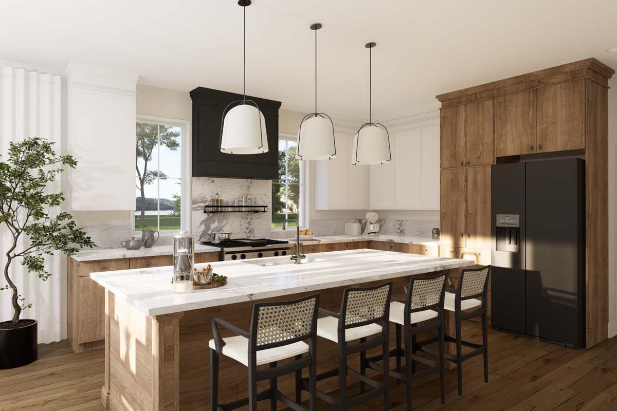 Kitchen with island seating, range hood, marble countertops, wood cabinetry, and a black refrigerator.