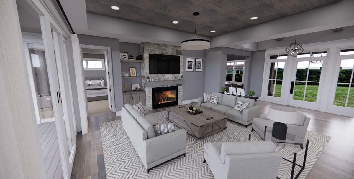 Great room with stone fireplace, seating area, wood-paneled ceiling, and sliding glass doors to exterior.