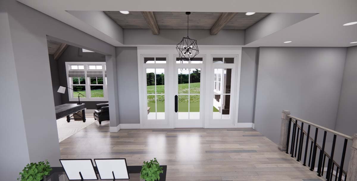 Interior view of house plan showing a foyer with double doors, wood ceiling beams, and a staircase.