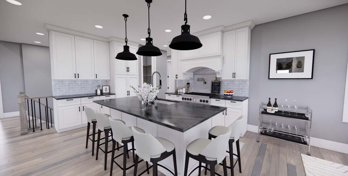 Kitchen interior with large island, white cabinetry, gray subway tile backsplash, and pendant lighting.