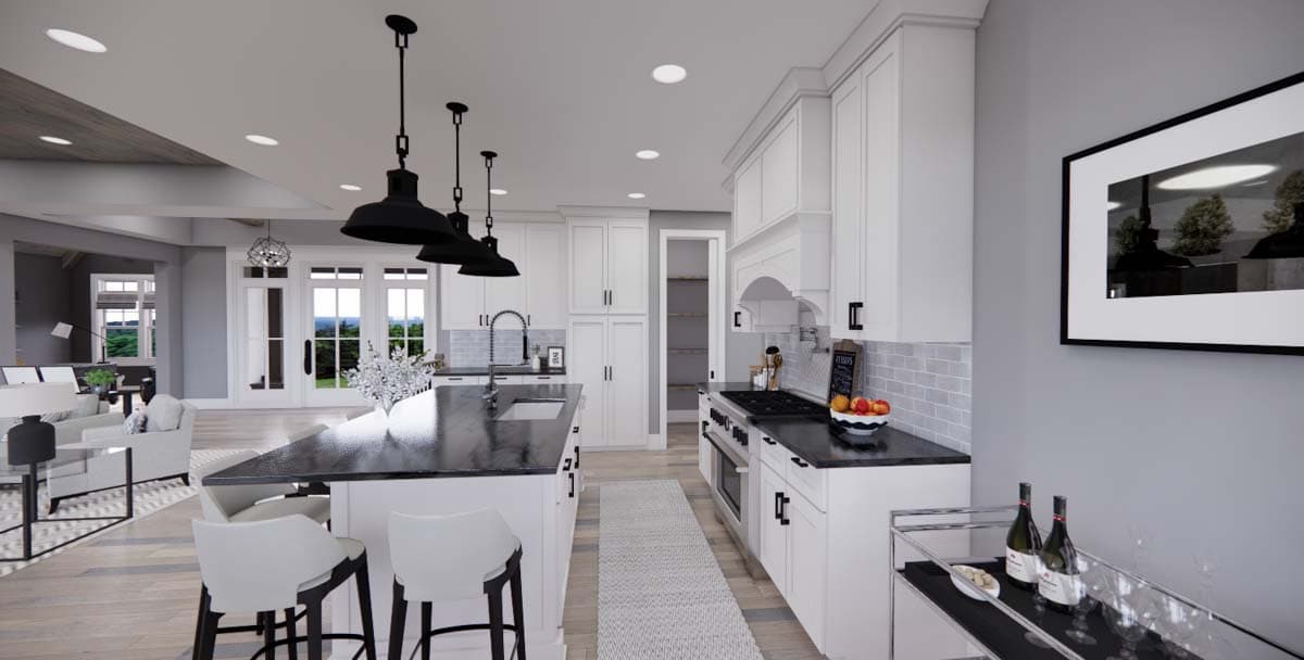 Kitchen with island, white cabinets, dark countertops, gas range, and pantry. Adjacent living area with fireplace and French doors visible.