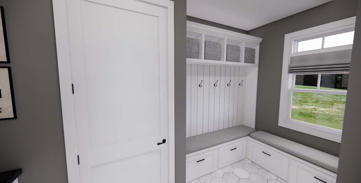 Mudroom with built-in bench seating, storage cubbies, coat hooks, and a shiplap accent wall.