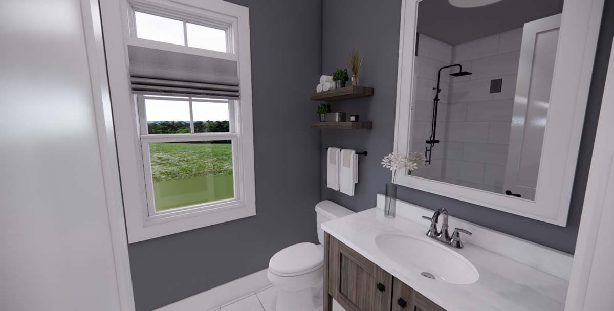 Bathroom interior with vanity, sink, toilet, walk-in shower, and window. Two shelves with towels and decor above the toilet.