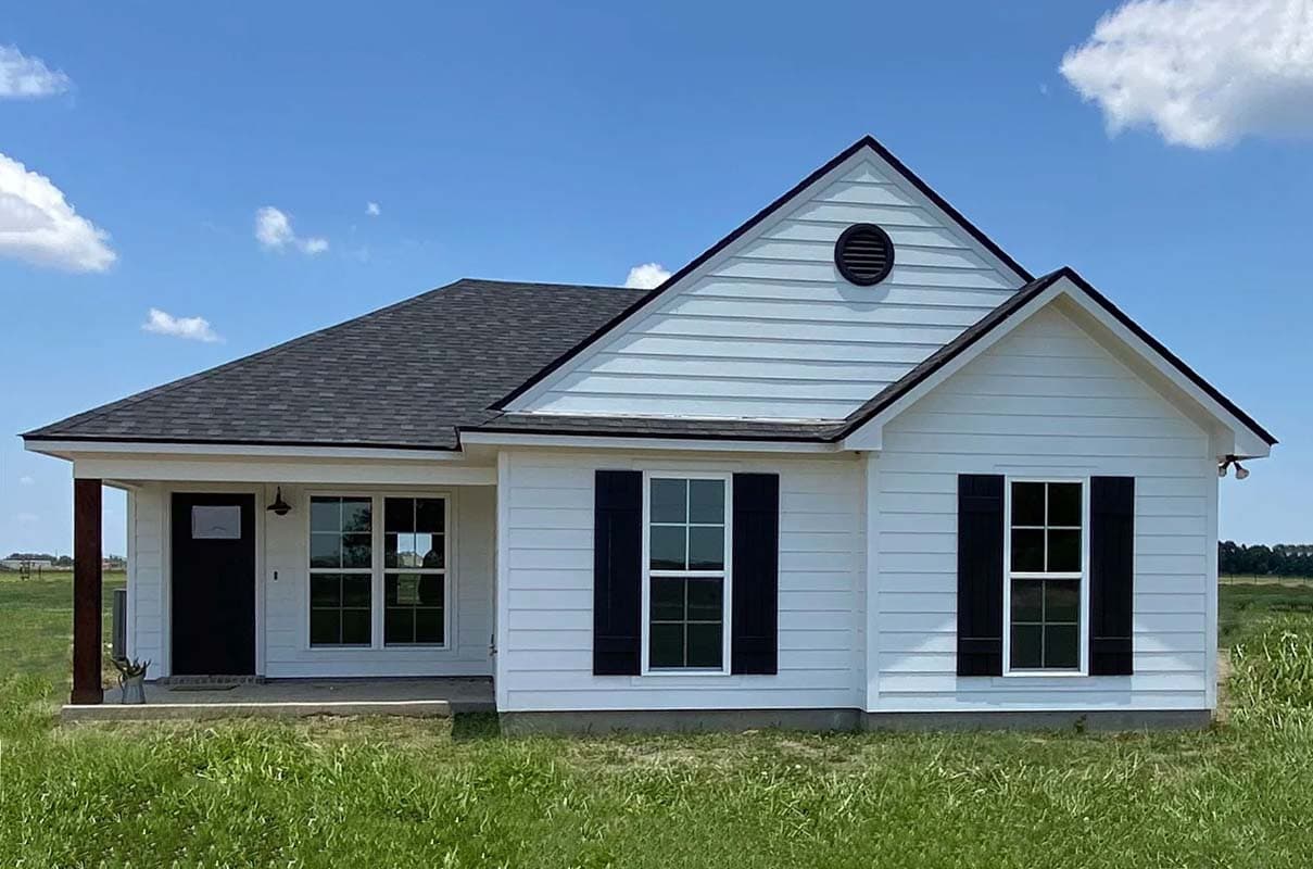 House plan exterior. One-story structure with gable roof, front porch with columns, and black shutters on the windows.