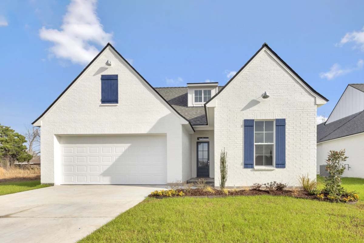 House plan exterior with white brick, gabled roof, dormer, garage, and blue shutters.