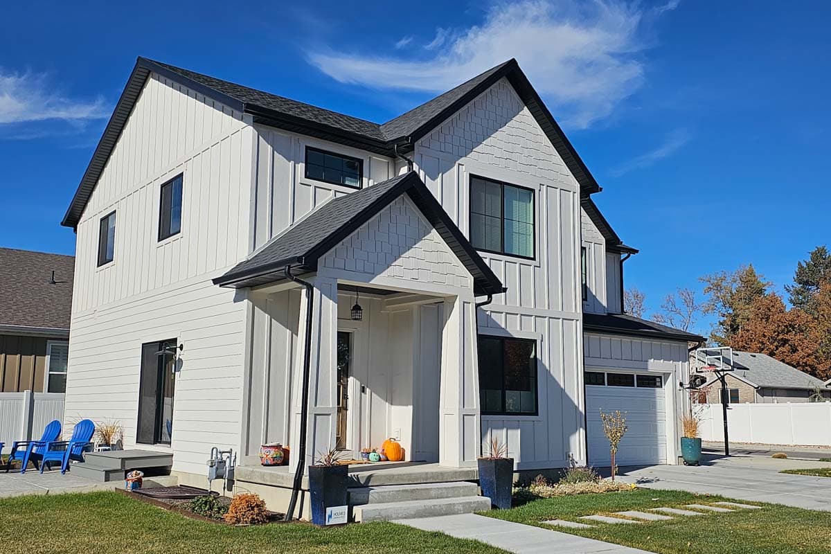 Modern Farmhouse house plan exterior, two stories, with board and batten siding, gables, and attached garage.