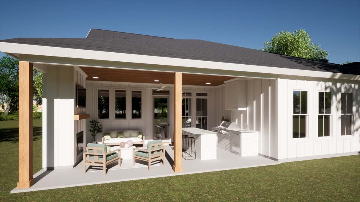 Modern Farmhouse house plan exterior with covered patio, outdoor kitchen, fireplace, and seating area.