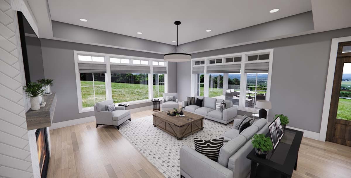 Living room with fireplace, large windows, sofa, chairs, coffee table, and rug. House plan rendering.