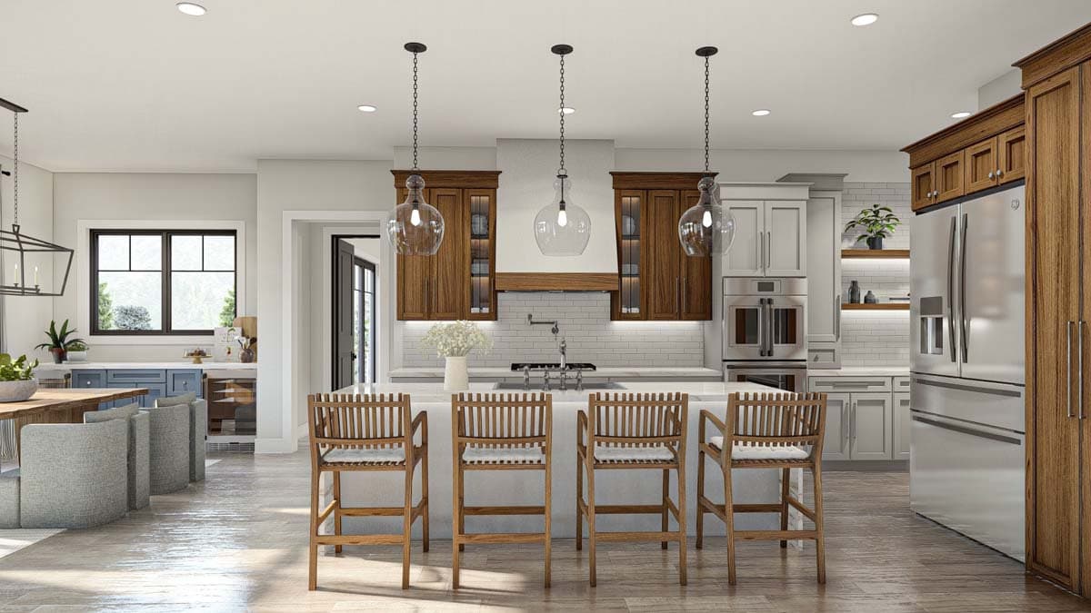 Modern kitchen with island, wood cabinetry, stainless steel appliances, subway tile backsplash, and pendant lighting.