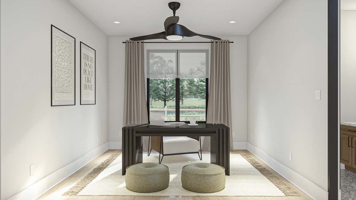 Home office with desk, chair, two poufs, and artwork on wall. Modern ceiling fan above.