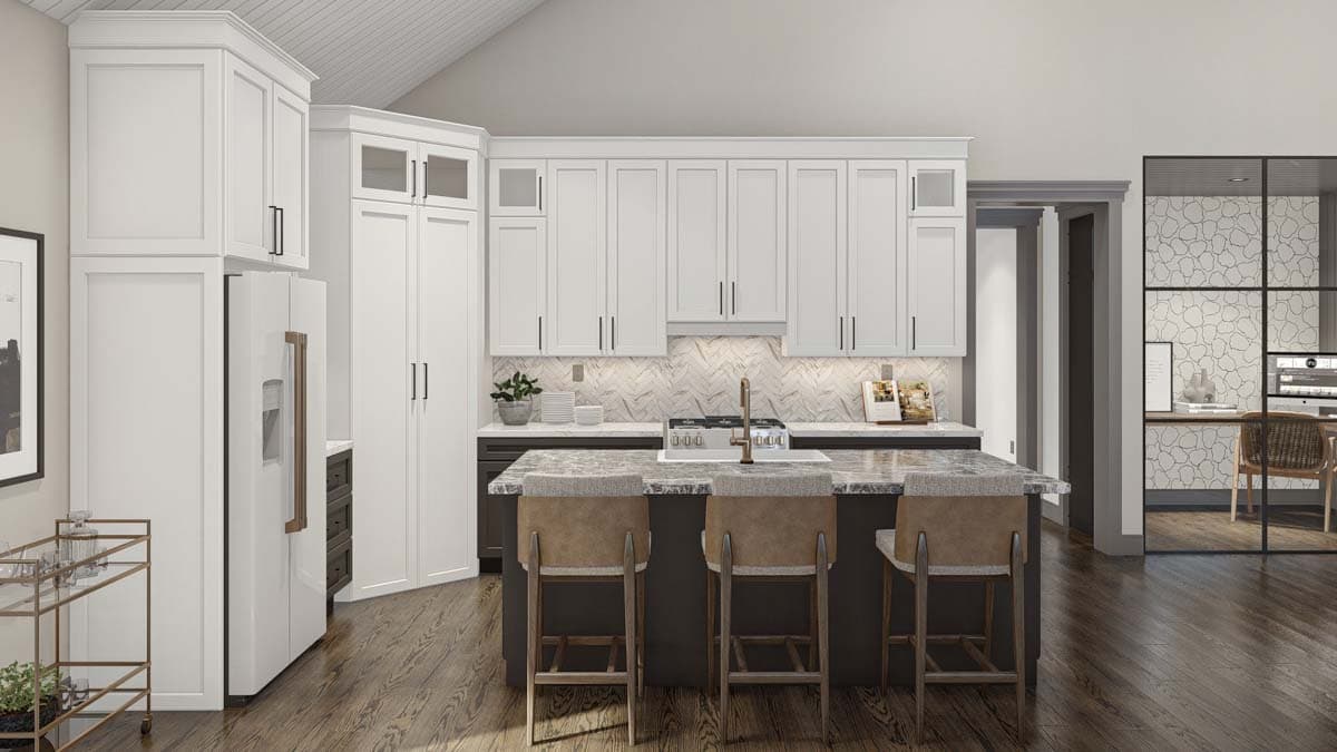 Kitchen with vaulted ceiling, white cabinetry, island with bar seating, and herringbone tile backsplash. Adjacent office area visible.