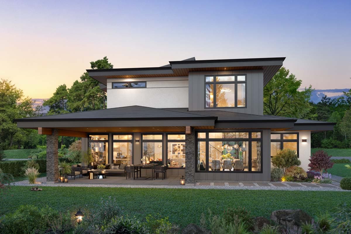 Modern house plan exterior with multiple gables, large windows, covered patio, and stone column accents.