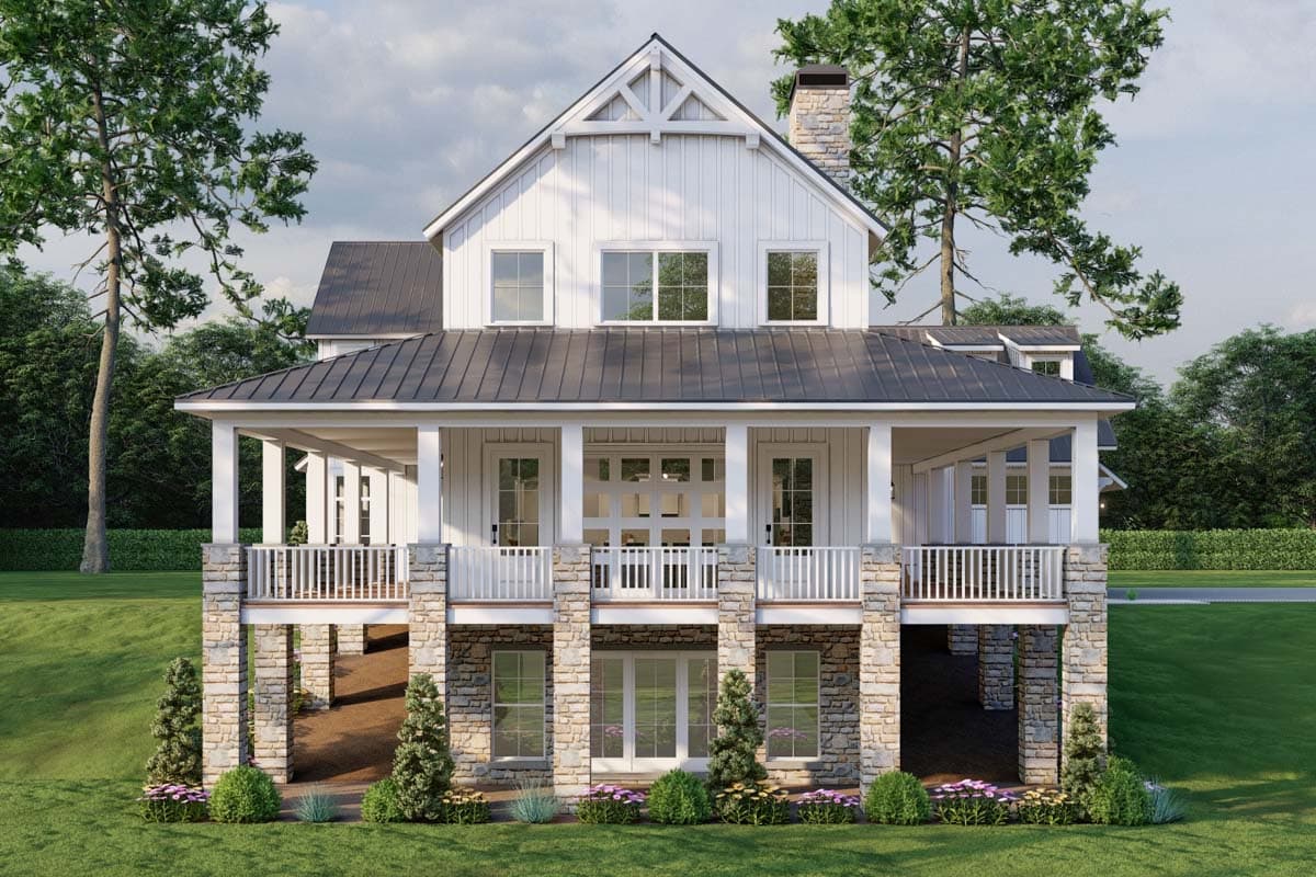 House plan exterior: Two-story Modern Farmhouse with wrap-around porch, metal roof, stone foundation, and prominent gable.