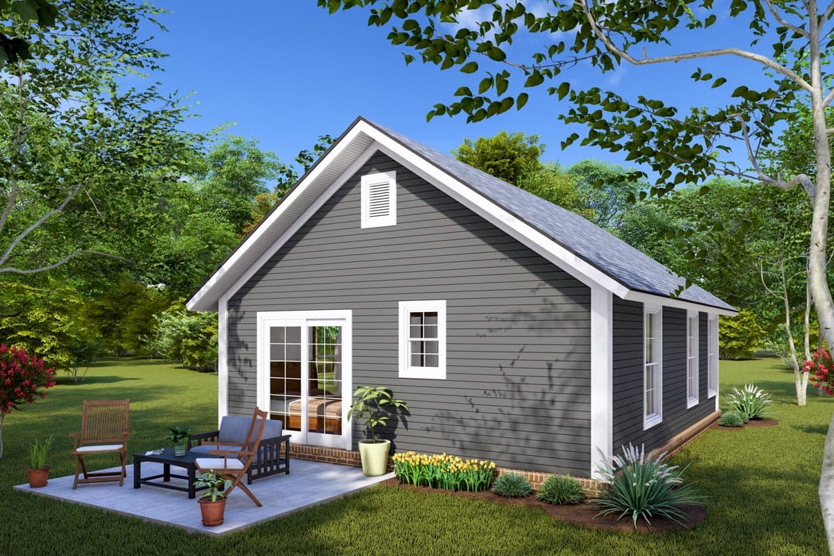 House plan exterior of a one-story home with gray siding, gable roof, dormer, and patio with furniture.