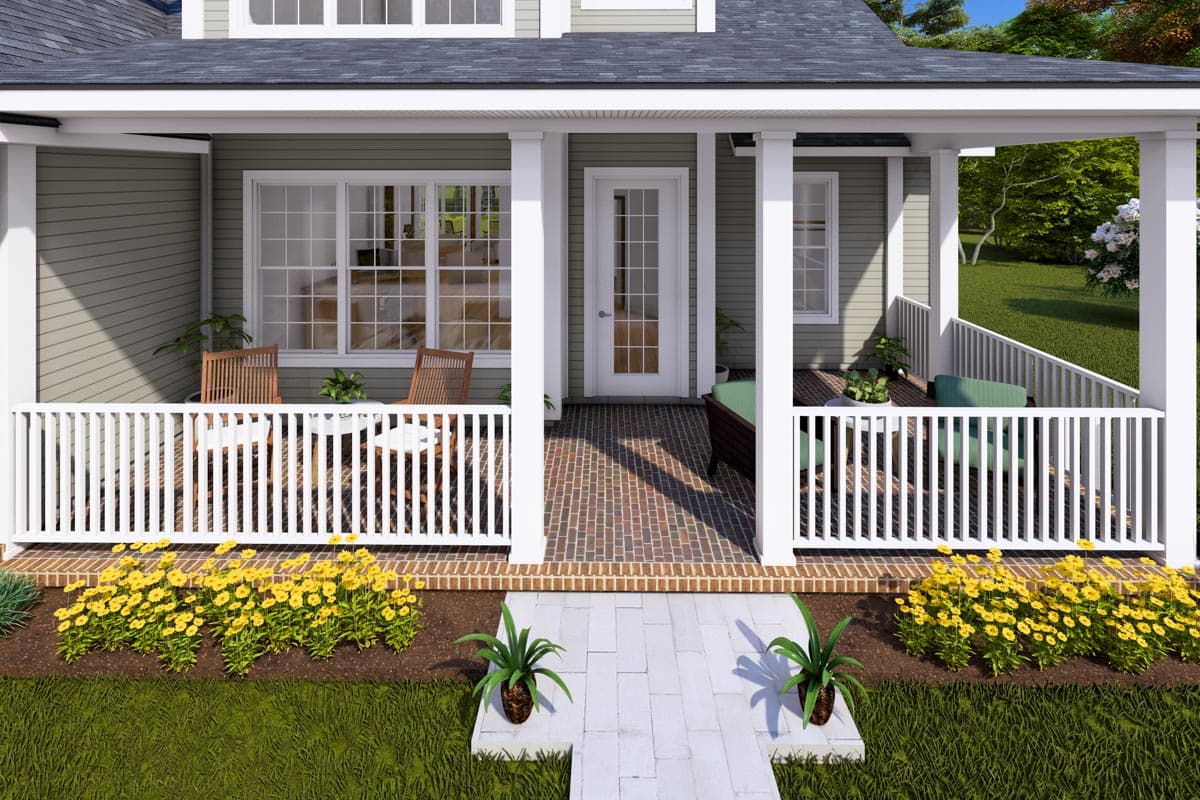 House plan exterior: Two-story home with a wrap-around porch, white railings, columns, and gabled dormers.