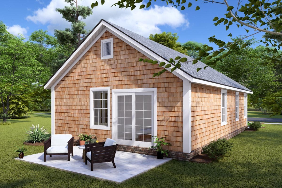 House plan exterior with cedar shake siding, gable roof, a dormer window, and a patio with seating.