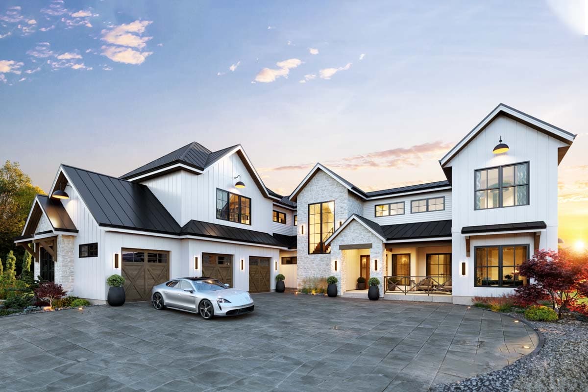 Modern Farmhouse house plan exterior with a white board and batten finish, stone accents, a multi-car garage, and steep gables.