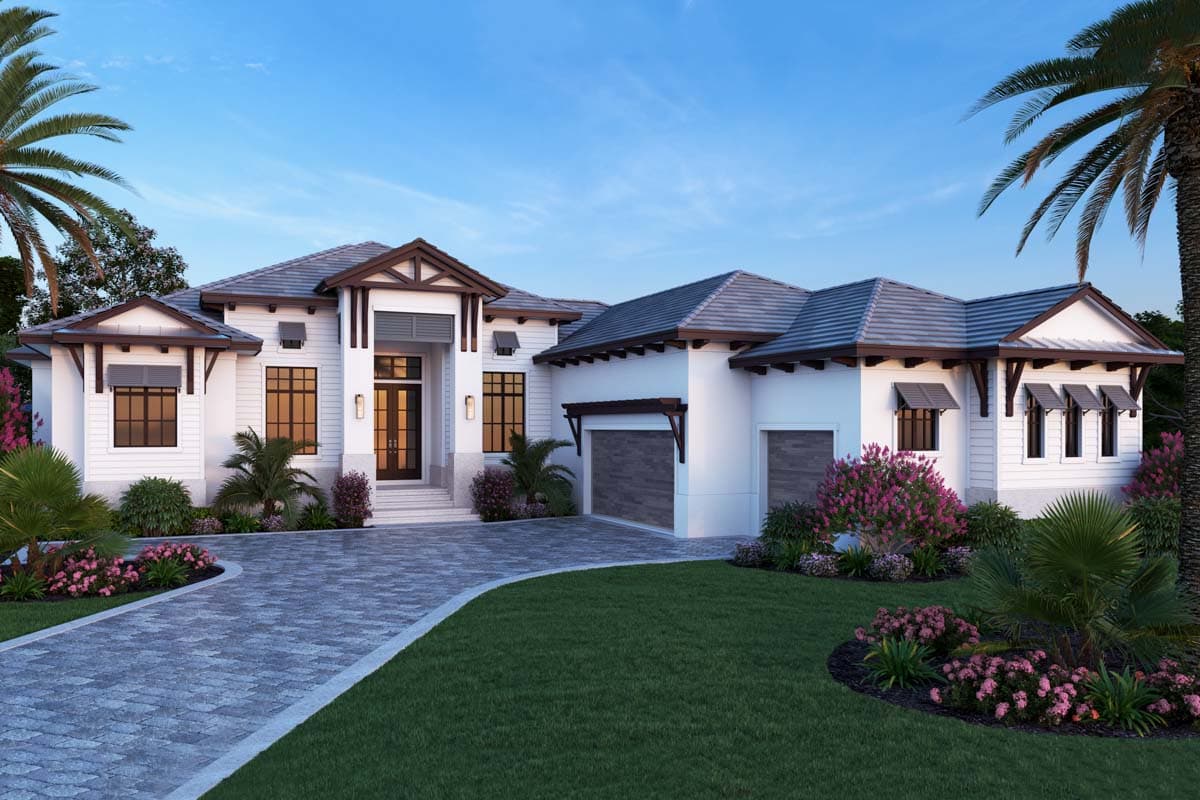 House plan exterior. Two-story home with a gabled roof, shuttered windows, and a detached garage. A covered entryway and paver driveway are featured.