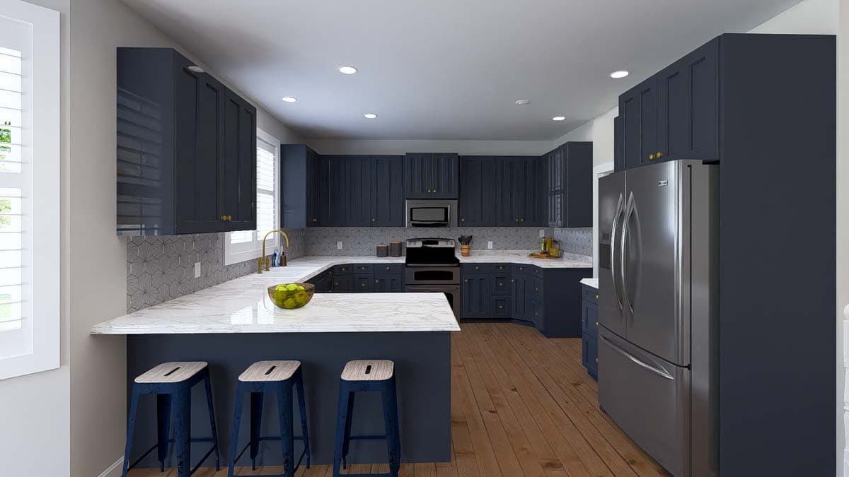 Kitchen interior with navy blue cabinets, marble countertops, an island with bar stools, and stainless steel appliances.