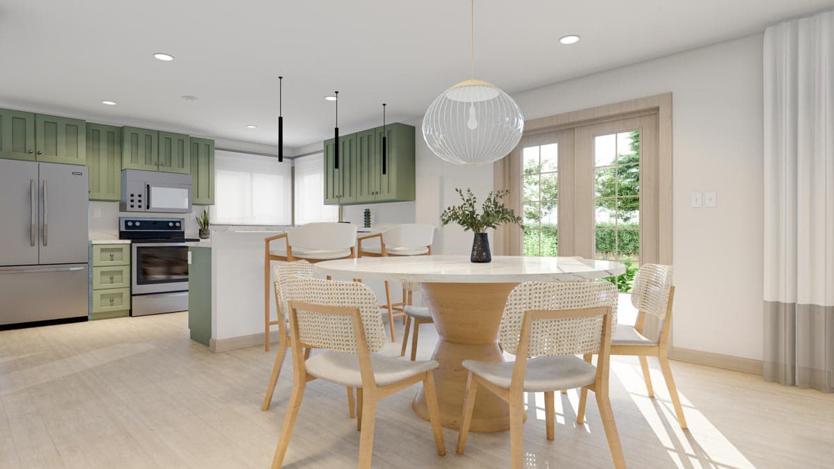 Kitchen and dining area with green cabinets, stainless steel appliances, island with bar stools, and a round dining table with cane-back chairs.