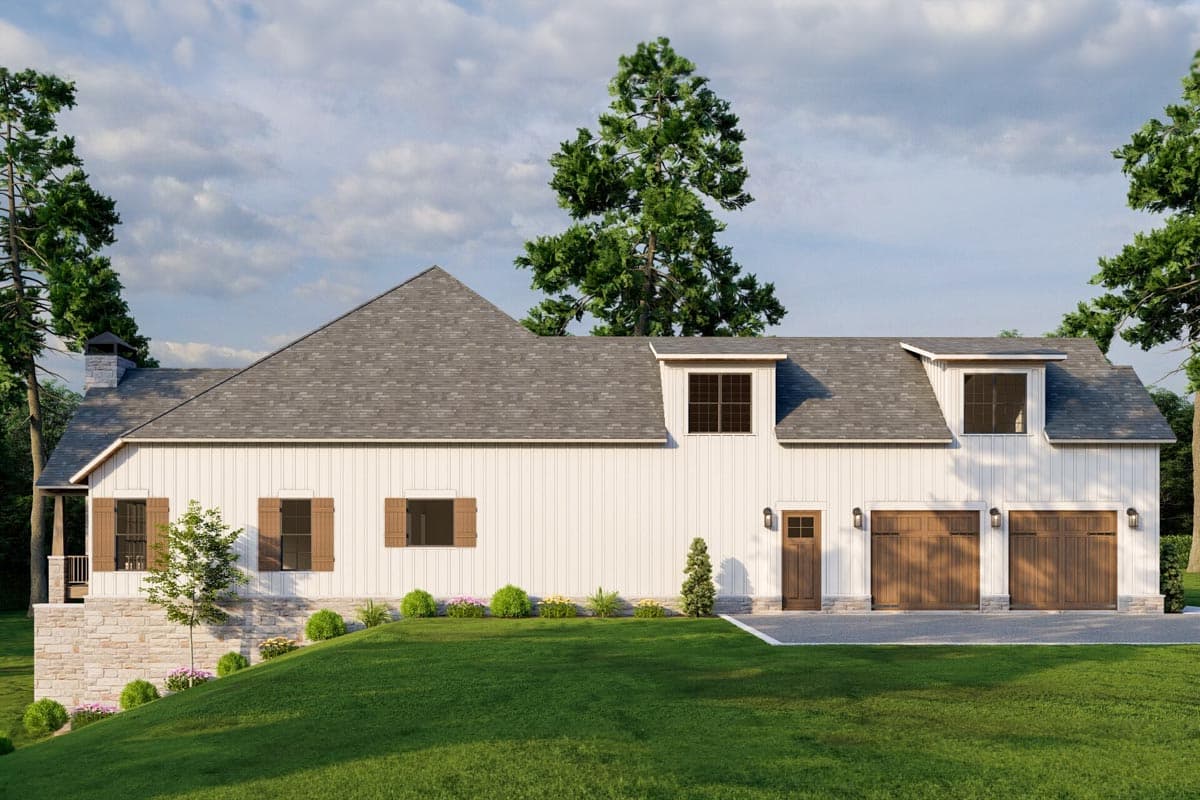 House plan exterior: Modern Farmhouse style, two stories, white board and batten siding, stone foundation, dormers, and a three-car garage.