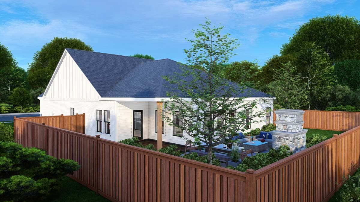 House plan exterior: single-story modern farmhouse with white siding, dark gables, and a covered patio with an outdoor fireplace.