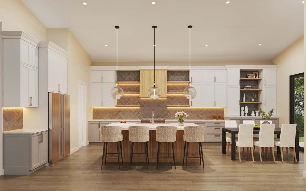Kitchen and dining area with large island, white cabinetry, herringbone backsplash, and dining table with chairs.