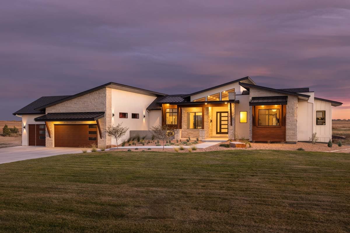 Modern ranch house plan exterior with stone accents, a detached garage, and a low-pitched roofline with clerestory windows.