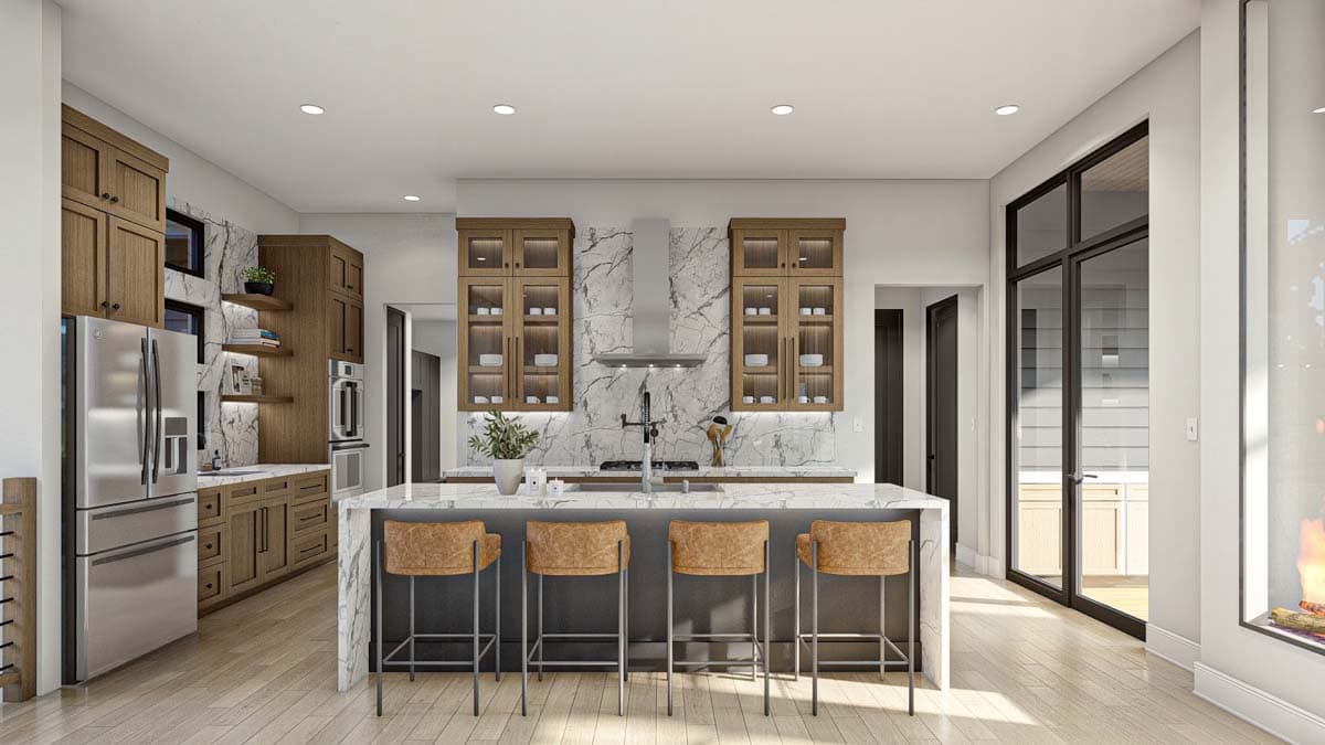 A modern kitchen with a large marble island and four leather bar stools. Wooden cabinets and stainless steel appliances provide a contrast.