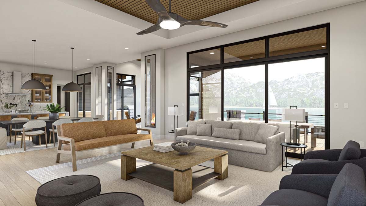 Spacious, modern living room with a neutral color palette, large windows showcasing a mountain lake view, and contemporary furniture.