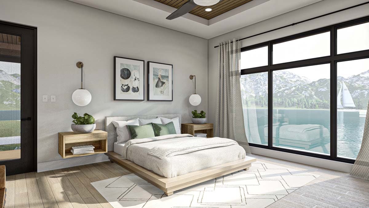 Modern bedroom with a large window overlooking a lake and mountains. A bed, artwork, and minimalist decor complete the scene.