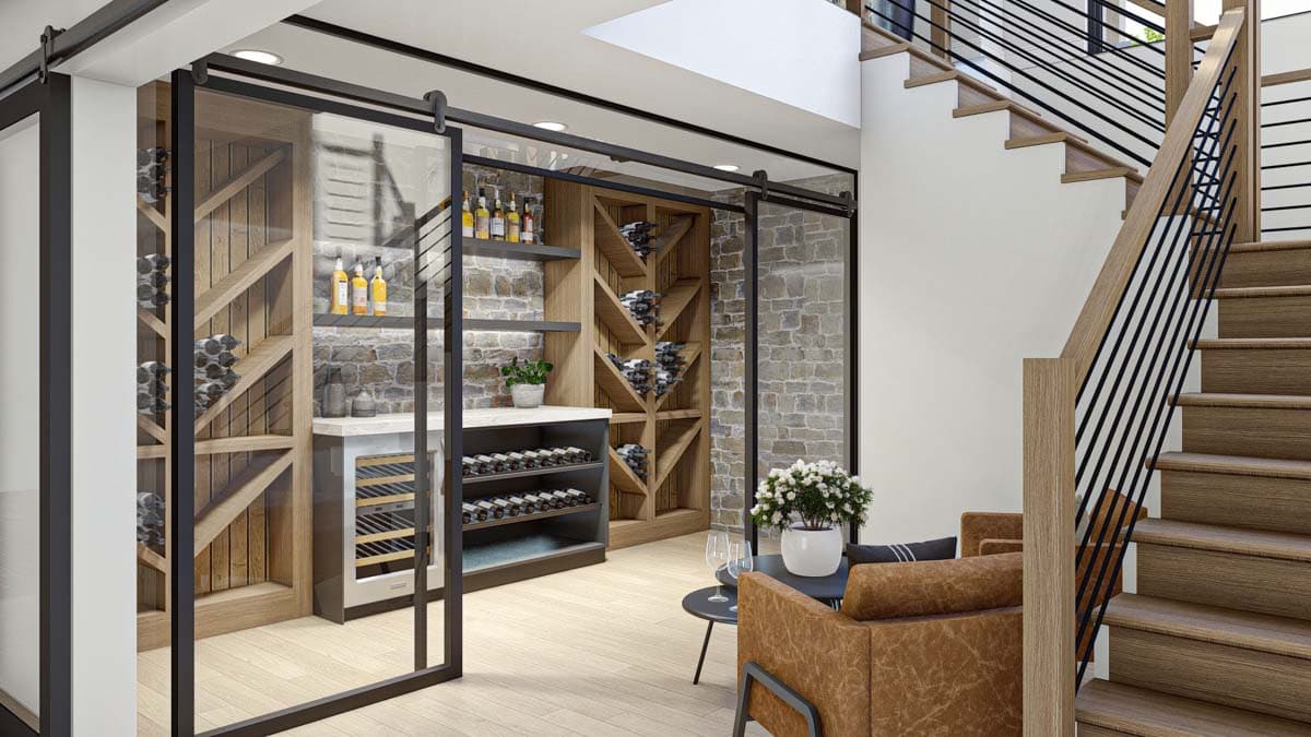 Modern wine cellar with sliding glass doors, wooden shelving, and stone accent walls, next to stairs with black metal railings.