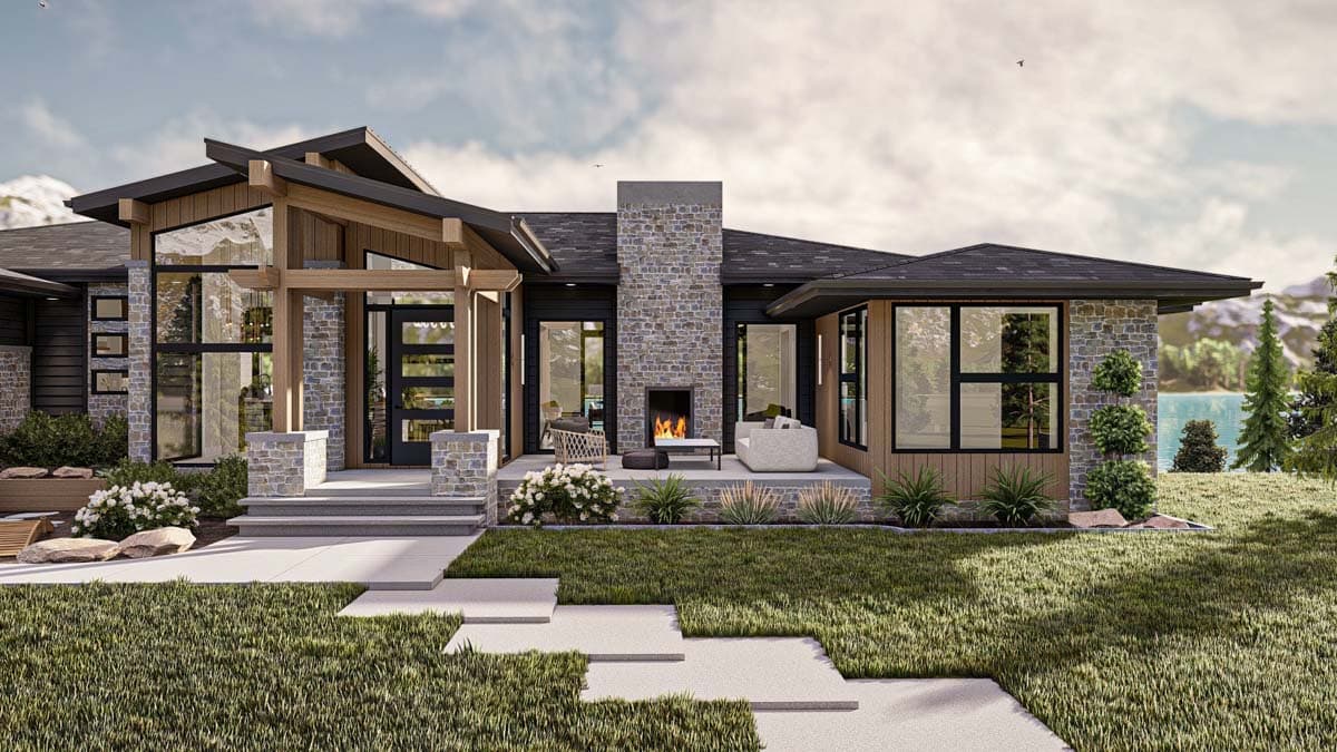 Modern home exterior with stone and wood accents, an outdoor fireplace, and large windows. Landscaping includes green grass, bushes, and a pathway.