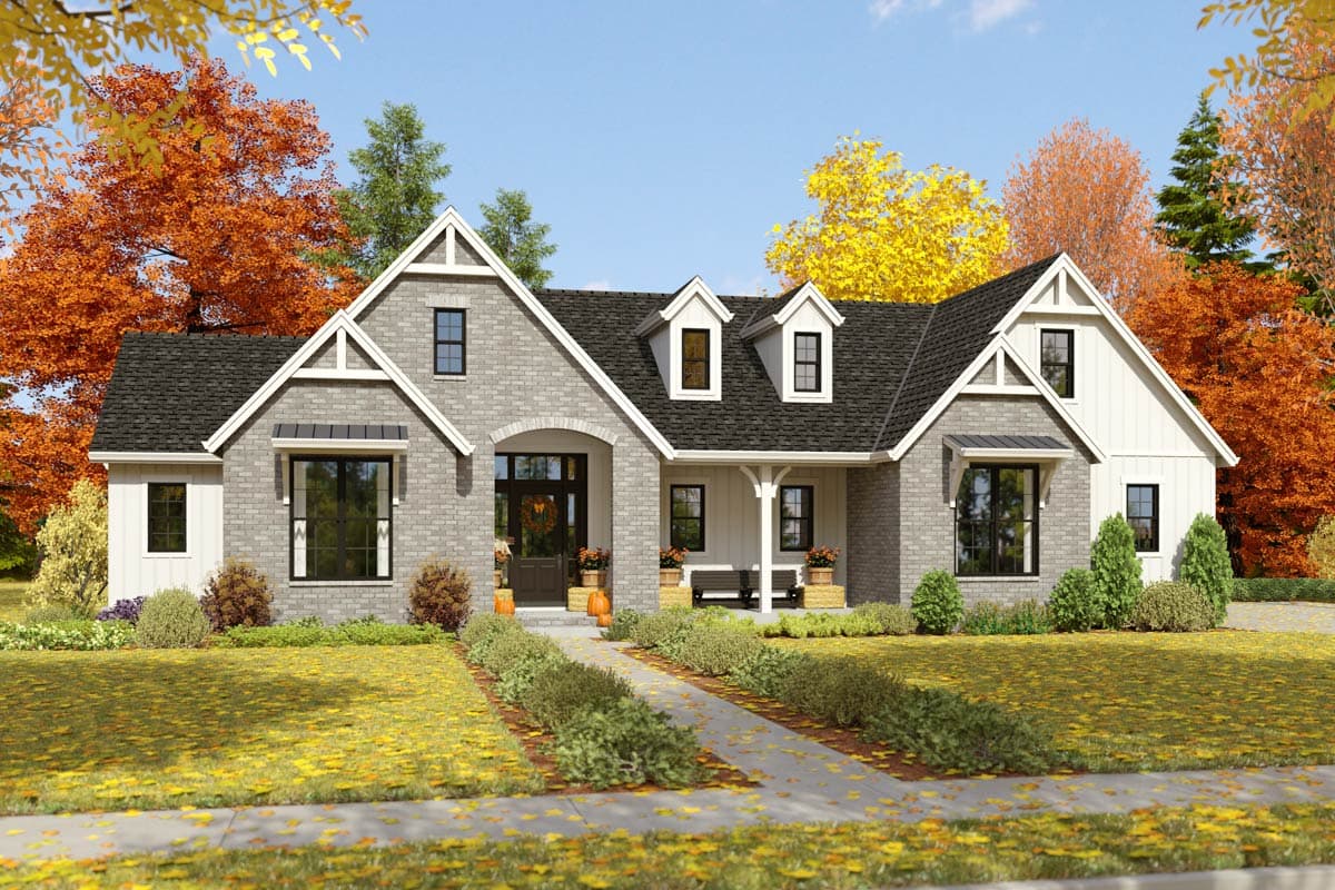 House plan exterior: Modern Farmhouse style, one-story, with brick facade, gables, dormers, and covered porch.