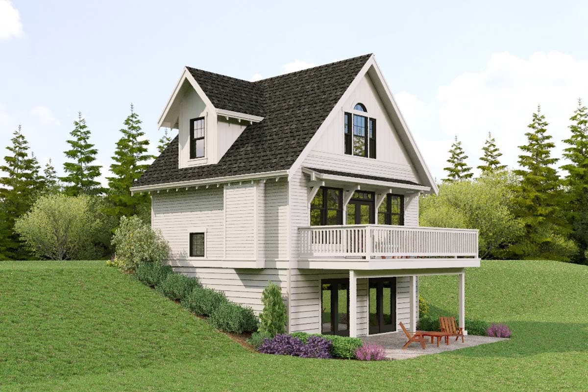 Modern farmhouse house plan exterior with dormer, gabled roof, and large deck overlooking a sloped lawn.