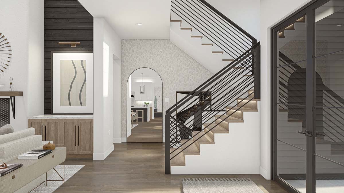 Contemporary interior rendering with staircase featuring wood treads, black metal railing, and view into kitchen through arched opening.