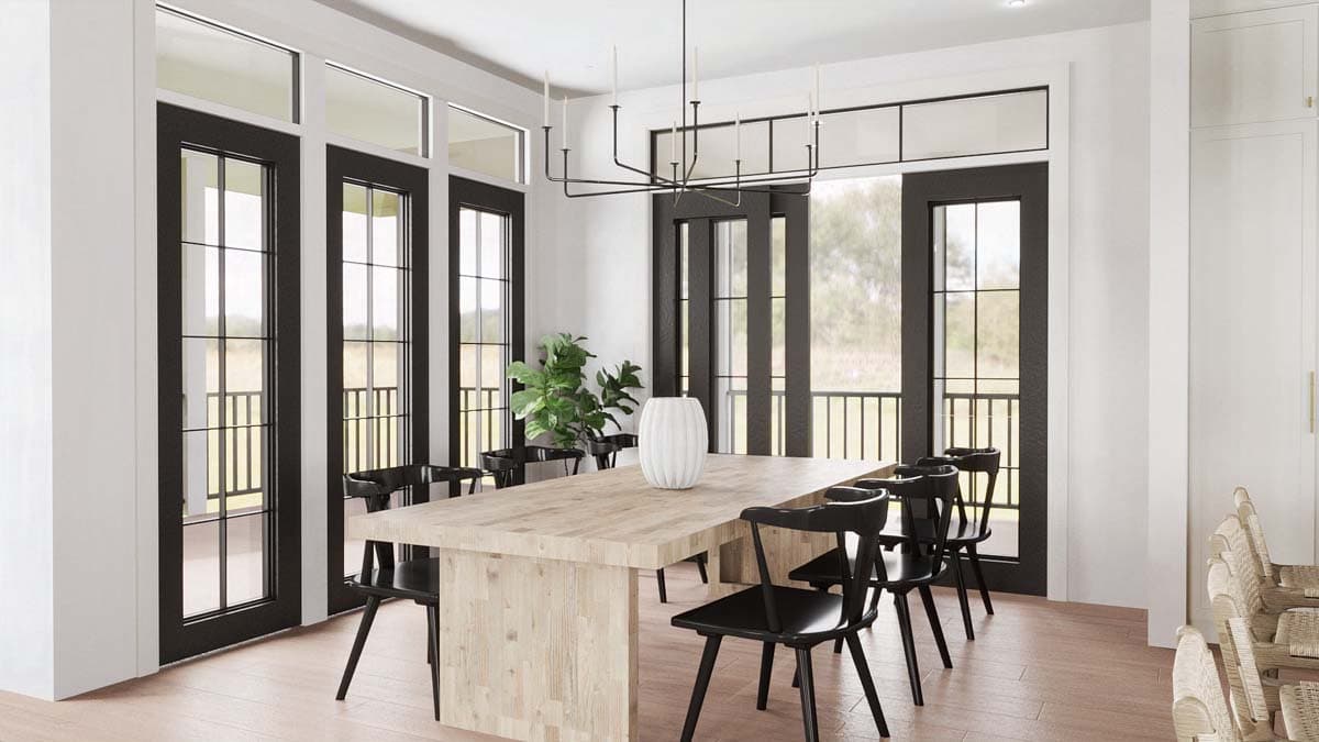 Dining room with large wood table, black chairs, and French doors leading to a balcony.
