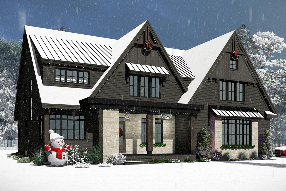 A snowy, two-story house with dark siding and a snow-covered roof. A snowman stands in the yard, and a Christmas wreath adorns the entrance.