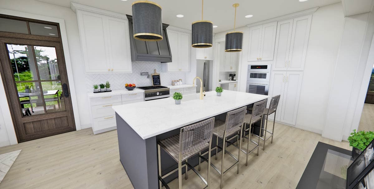Modern kitchen with a large island with seating, pendant lights, and stainless steel appliances. A glass door opens to a patio.