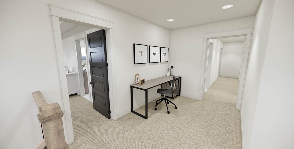 Hallway with desk, chair, and art. A black door leads to a room on the left. Another doorway leads to a hallway on the right with carpet.