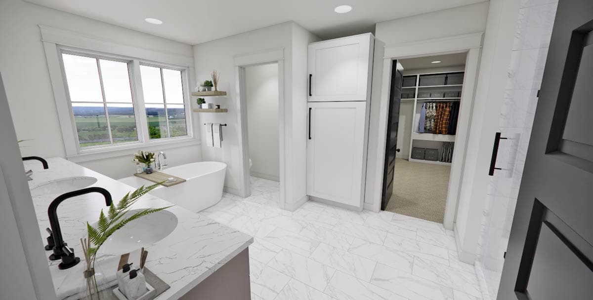 Spacious, modern bathroom with marble tile floors, a soaking tub, double vanity, large windows, and an adjacent walk-in closet.