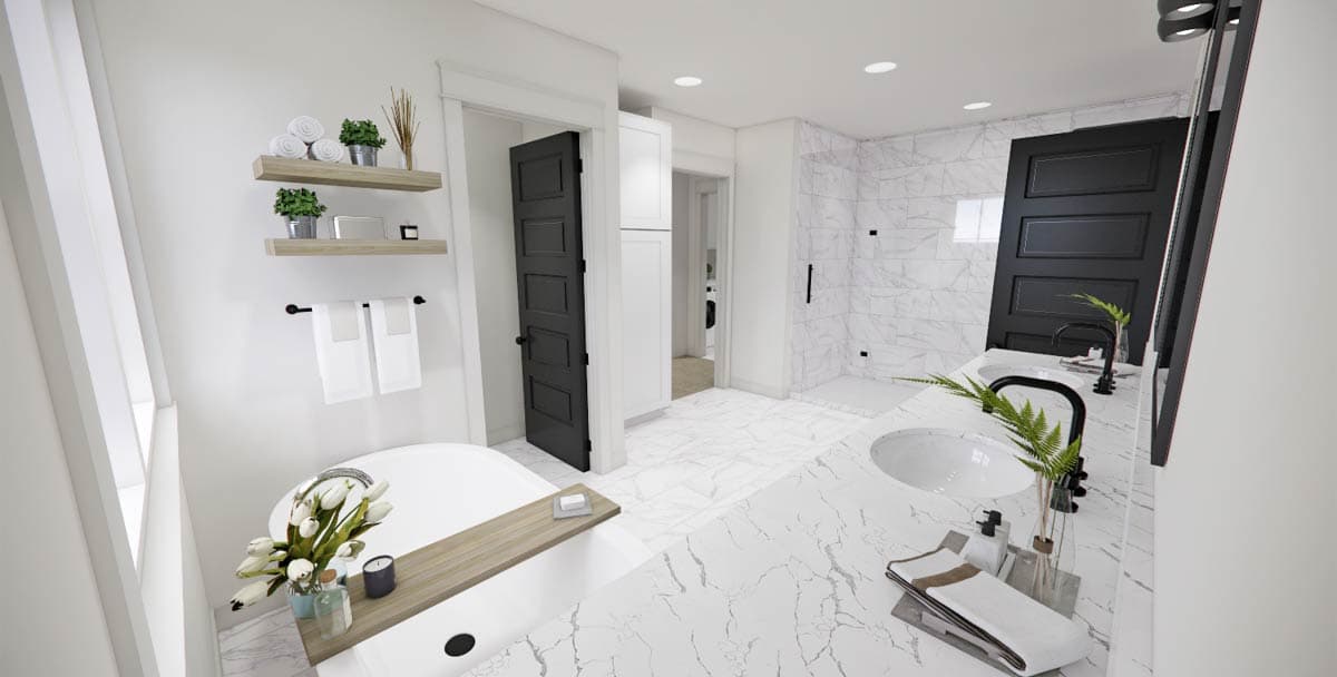 Modern bathroom featuring marble flooring and countertops, a large bathtub, black accents, and a marble-tiled shower in the background.