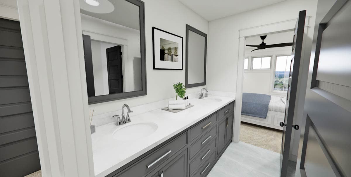 Modern bathroom with a double sink vanity in gray, framed mirrors, and a glimpse of a bedroom through an open doorway.