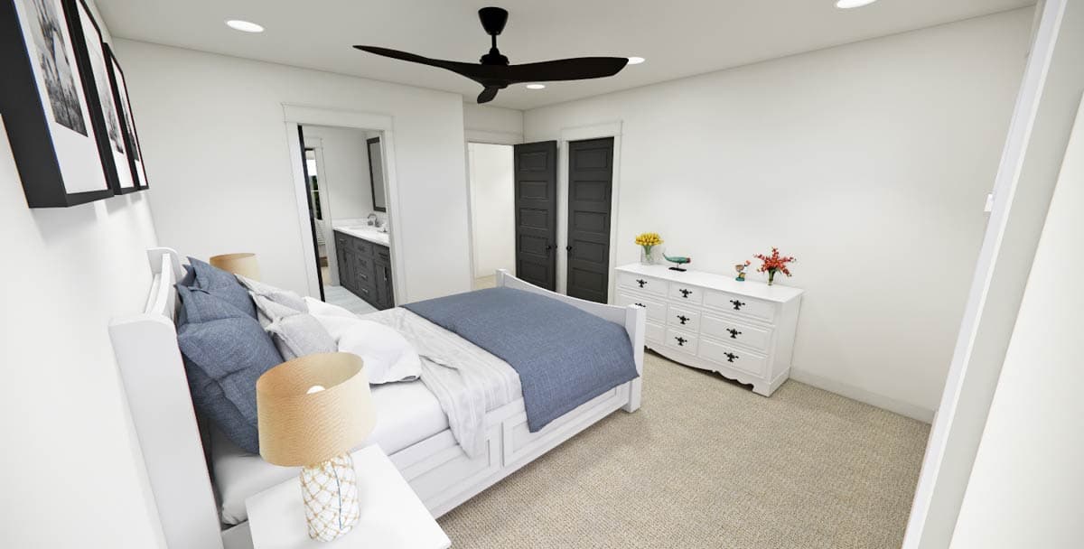 A modern bedroom with white walls, a white bed, and a blue blanket. Black framed artwork hangs on the wall, and black doors are visible.