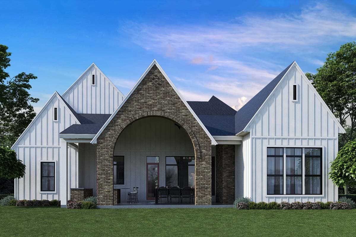 Modern Farmhouse house plan exterior with board and batten siding, gables, and arched brick entry.
