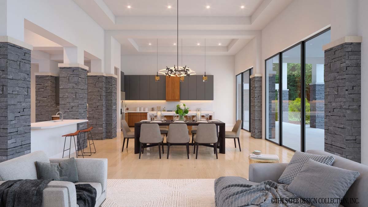Interior rendering of a great room with kitchen and dining area, featuring stone-clad columns, coffered ceiling, and expansive windows.
