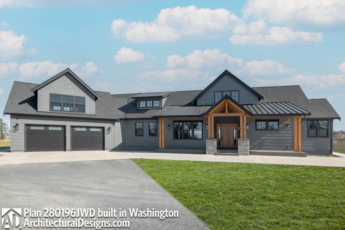 Modern Farmhouse house plan exterior with two-car garage, gabled dormers, wood-beam entry, and metal roof.