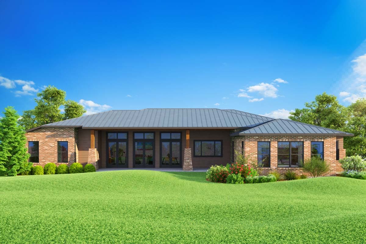 House plan exterior: Single-story Modern Farmhouse with metal roof, brick accents, covered patio with French doors, and numerous windows.