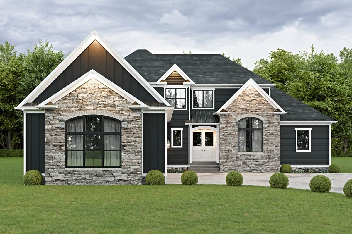 House plan exterior. Two-story home with stone accents, prominent gables, arched windows, and a central double-door entrance.